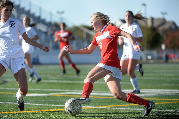 (Scott Sommerdorf   |  The Salt Lake Tribune)   East forward Emily Jensen dribbles toward the goal past the defense of Corner Canyon's Makenzie Easton during first half play. East beat Corner Canyon 4-1 in a Class 5A girls' soccer state quarterfinal, Thursday, October 12, 2017. 