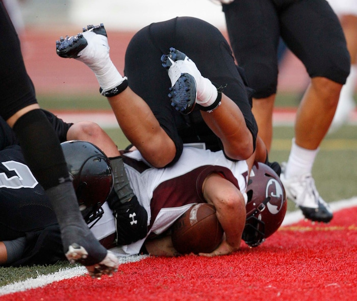 (Trent Nelson  |  The Salt Lake Tribune)  Jordan quarterback Austin Kafentzis scores a first half touchdown. Alta vs. Jordan High School football in Sandy, Utah, on Friday, September 16, 2011.