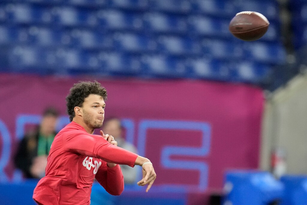 BYU quarterback Jaren Hall warms up before he runs a drill at the NFL football scouting combine in Indianapolis, Saturday, March 4, 2023. (AP Photo/Michael Conroy)