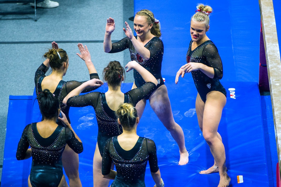 Chris Detrick  |  The Salt Lake TribuneUtah gymnast Maddy Stover celebrates with her teammates after performing on the beam during the Red Rocks Preview at the Huntsman Center Friday December 11, 2015.  