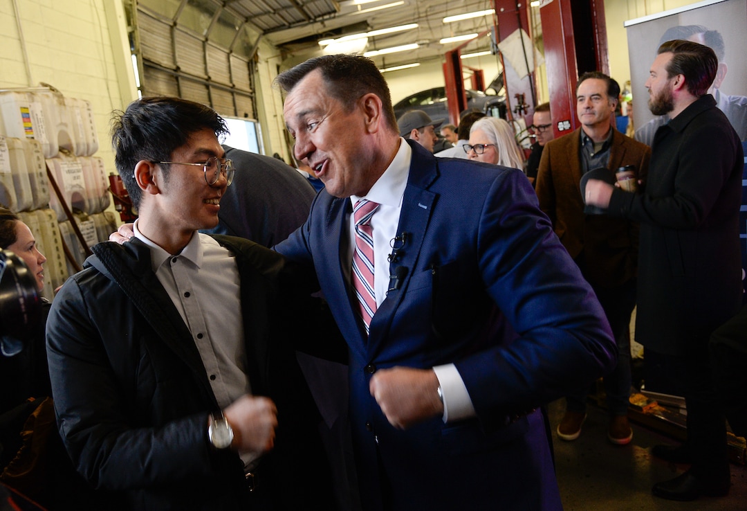 (Francisco Kjolseth  |  The Salt Lake Tribune) International student at BYU Haoran Shu, who says he is volunteering on the campaign of former House Speaker Greg Hughes, expresses his enthusiasm for Hughes' run for governor at Dee's Automotive in Murray on Wednesday, Jan. 8, 2020.