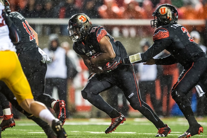 Chris Detrick  |  The Salt Lake Tribune
Utah Utes quarterback Troy Williams (3) hands off to Utah Utes running back Armand Shyne (23) during the game at Rice-Eccles Stadium Friday September 23, 2016. Utah Utes defeated USC Trojans 31-27.