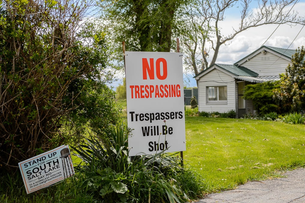 (Trent Nelson | The Salt Lake Tribune)
The South Salt Lake City Council called a special meeting to hear about why there are delays with building a new shelter in that town. Meanwhile, neighbors in the area of the new shelter are holding out for more money from the county and state before agreeing to sell their homes and move. Some have put up signs warning trespassers they'll be shot if they step on the property. Wednesday May 2, 2018.