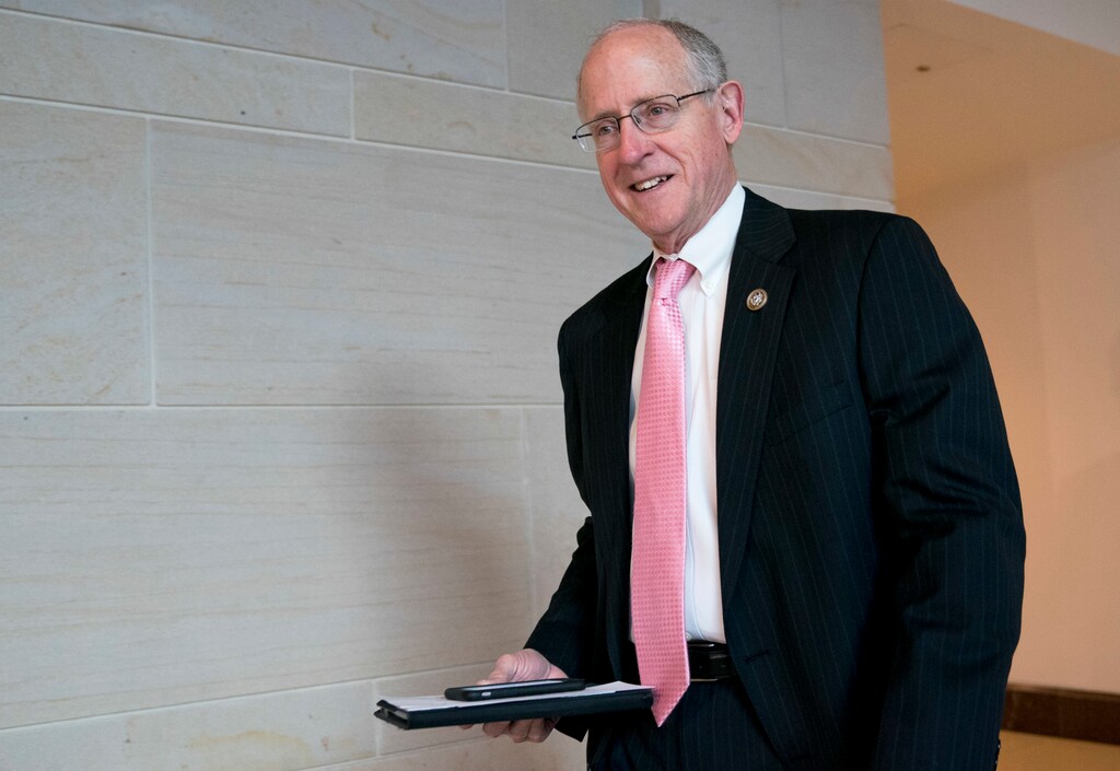 (Andrew Harnik | The Associated Press) In this March 8, 2018, photo, Rep. Mike Conaway, R-Texas, left, at the Capitol in Washington. Republicans on the House intelligence committee have completed a draft report concluding there was no collusion or coordination between Donald Trump's presidential campaign and Russia. The finding is sure to please the White House and enrage panel Democrats who have not yet seen the document. After a yearlong investigation, Conaway says the committee has finished doing witness interviews.