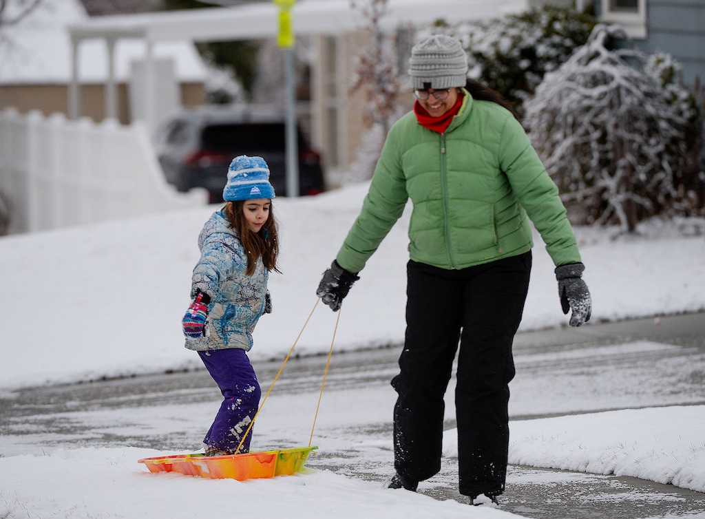 (Leah Hogsten  |  Tribune file photo) A woman pulls her daughter home on a sled in Bountiful after an afternoon Jan. 14, 2020. Bountiful was named the third safest city in Utah for 2021, after Spanish Fork, Syracuse and Kaysville.