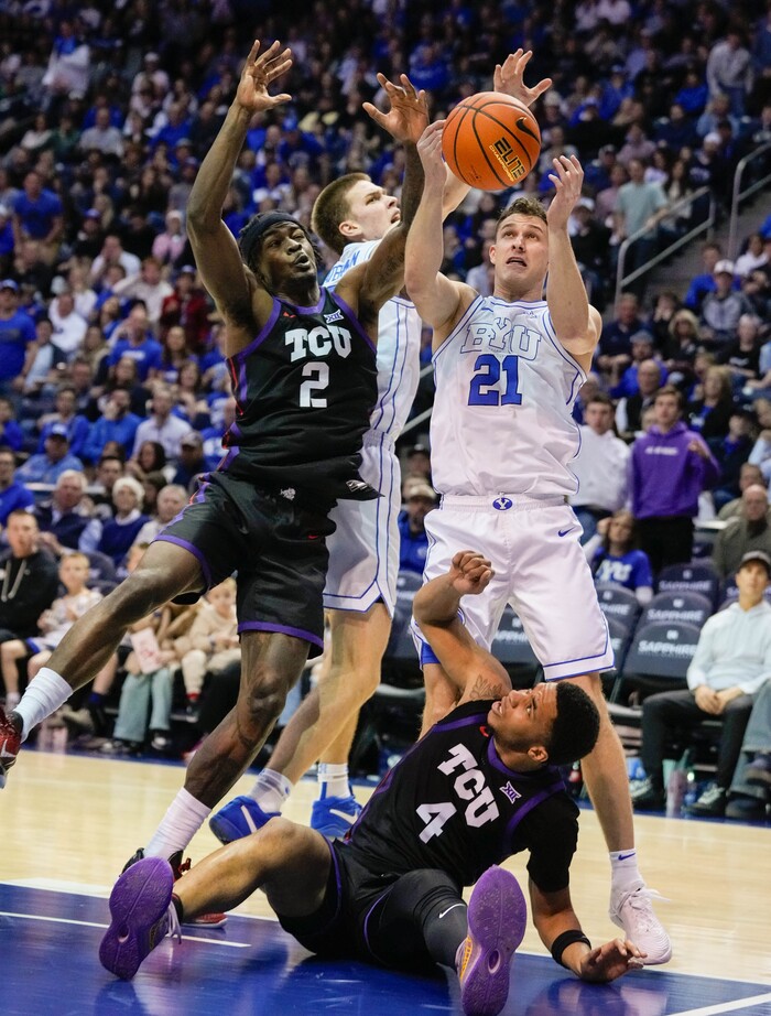 (Francisco Kjolseth | The Salt Lake Tribune) TCU Horned Frogs guard Jameer Nelson Jr. (4) end up on the floor as TCU Horned Frogs forward Emanuel Miller (2) battles Brigham Young Cougars forward Noah Waterman (0) and Brigham Young Cougars guard Trevin Knell (21) during an NCAA college basketball game against TCU Saturday, March 2, 2024, in Provo, Utah.