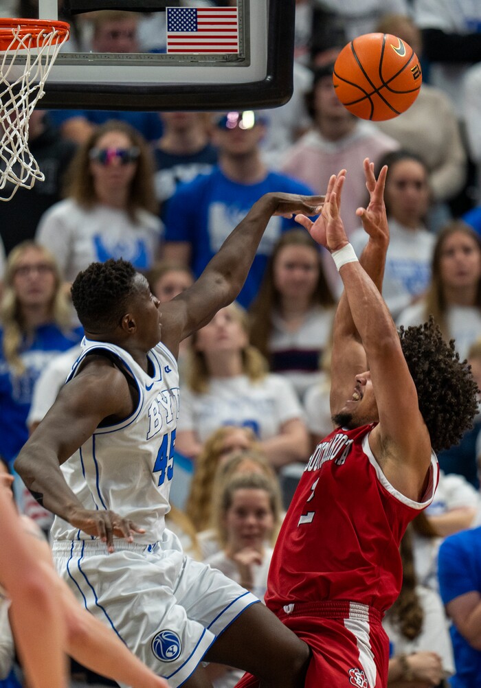 (Rick Egan | The Salt Lake Tribune)  Brigham Young Cougars forward Fousseyni Traore (45) blocks a shot by South Dakota Coyotes guard Damani Hayes (2), in basketball action between the Brigham Young Cougars and the South Dakota Coyotes, at Vivint Arena, in Salt Lake City, on Saturday, Dec. 3, 2022.
