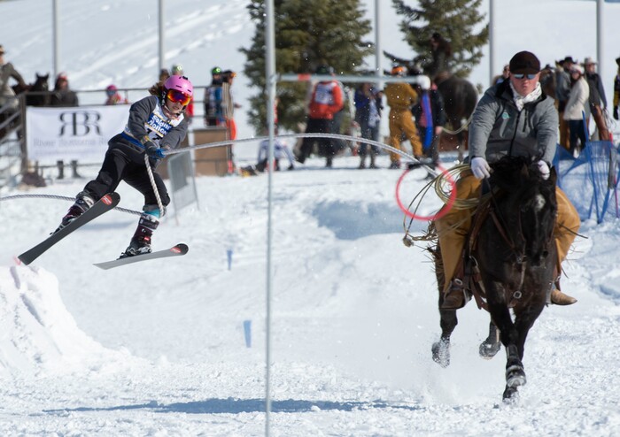 (Rick Egan | The Salt Lake Tribune) JP Holland How is pilled by Kendon Hortin and Counterfiet the horse, in Skijoring competition at Soldier Hollow Friday. Feb. 22, 2019. The competition continues on Saturday.