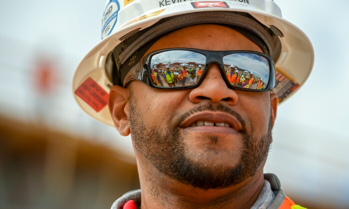 (Leah Hogsten  |  The Salt Lake Tribune) Kevin Washington, a project superintendent with Ludvik Electric said working on the new terminal building was "a lot of controlled chaos" during Wednesday's "topping out" ceremony to raise the last steel beams to a high point on the new Salt Lake City International Airport terminal building, Wednesday, May 23, 2018. The new $485 million terminal building will cover 866,087 square feet and used 11,000 tons of structural steel and 22 miles of steel piles.