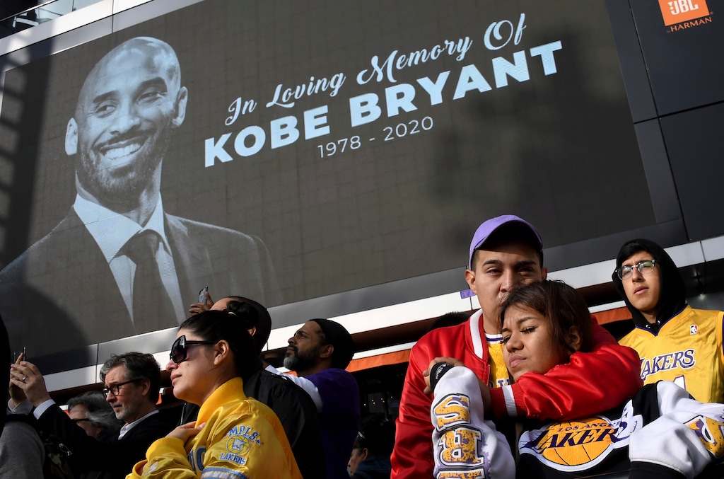 (Keith Birmingham/The Orange County Register via AP) Fans mourn the loss of Kobe Bryant in front of La Live across from Staples Center, home of the Los Angeles Lakers in Los Angeles on Sunday, Jan. 26, 2020. Bryant, the 18-time NBA All-Star who won five championships and became one of the greatest basketball players of his generation during a 20-year career with the Los Angeles Lakers, died in a helicopter crash Sunday.
