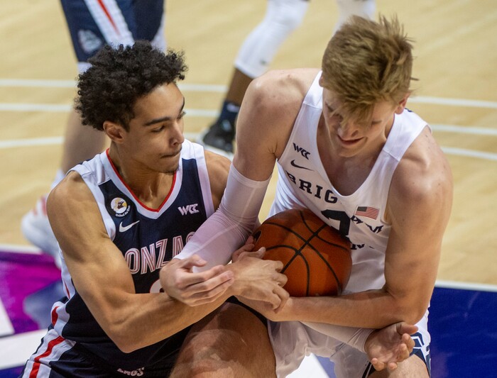 (Rick Egan | The Salt Lake Tribune)  Gonzaga Bulldogs guard Andrew Nembhard (3) goes after the ball along with Brigham Young Cougars forward Matt Haarms (3), in West Coast Conference Basketball action between the Brigham Young Cougars and the Gonzaga Bulldogs at the Marriott Center in Provo, on Monday, Feb. 8, 2021.