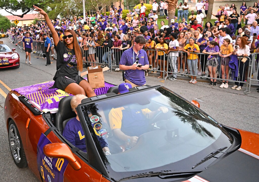 (Hilary Scheinuk | The New Orleans Advocate via AP) LSU forward Angel Reese waves to fans as the women's NCAA college national champion basketball team paraded across campus in Baton Rouge, La., on April 5, 2023. Angel Reese is still getting used to the idea that celebrity athletes and entertainers she's long wanted to meet are interested in meeting her, too — and thanking her for how she's elevated women's basketball.