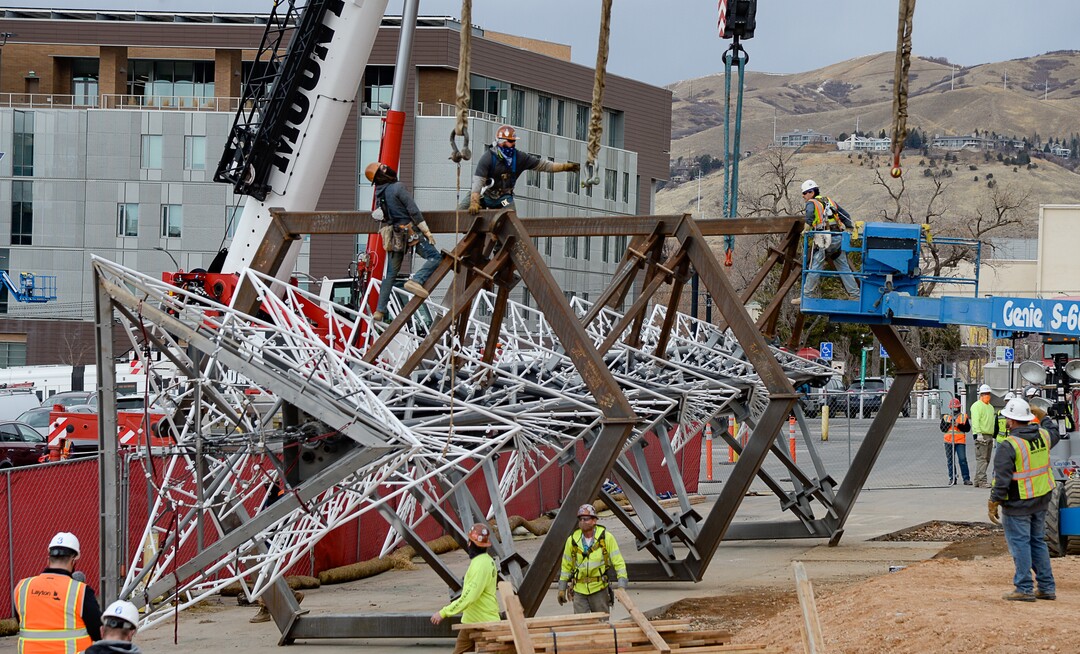 (Francisco Kjolseth  |  The Salt Lake Tribune) The Olympic cauldron is returned to the University of Utah on Friday, Jan. 29, 2021, after a refurbishment to lengthen its life span. Removed in February 2020, the cauldron was transported to an off-site location, where all 738 glass panes were removed and the complete structure was sandblasted and refinished. The refurbished structure was placed on a newly constructed, 17-foot-tall pedestal, just north of the stadium ticket office, with plans to add high-quality glass.
