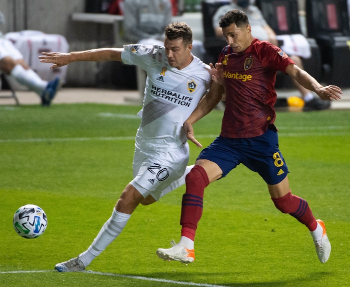 (Francisco Kjolseth  |  The Salt Lake Tribune) Los Angeles Galaxy forward Nick DePuy (20) battles Real Salt Lake midfielder Damir Kreilach (8) as Real Salt Lake hosts L.A. Galaxy at Rio Tinto Stadium in Sandy on Wednesday, Sept. 23, 2020.