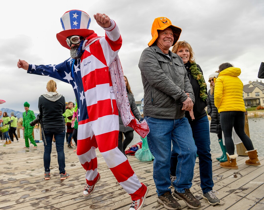 (Leah Hogsten  |  The Salt Lake Tribune)Bystanders get out of the way of Kyle America Fox during a dance contest at the annual Giant Pumpkin Regatta, October 19, 2019 on Oquirrh Lake in Daybreak, South Jordan.