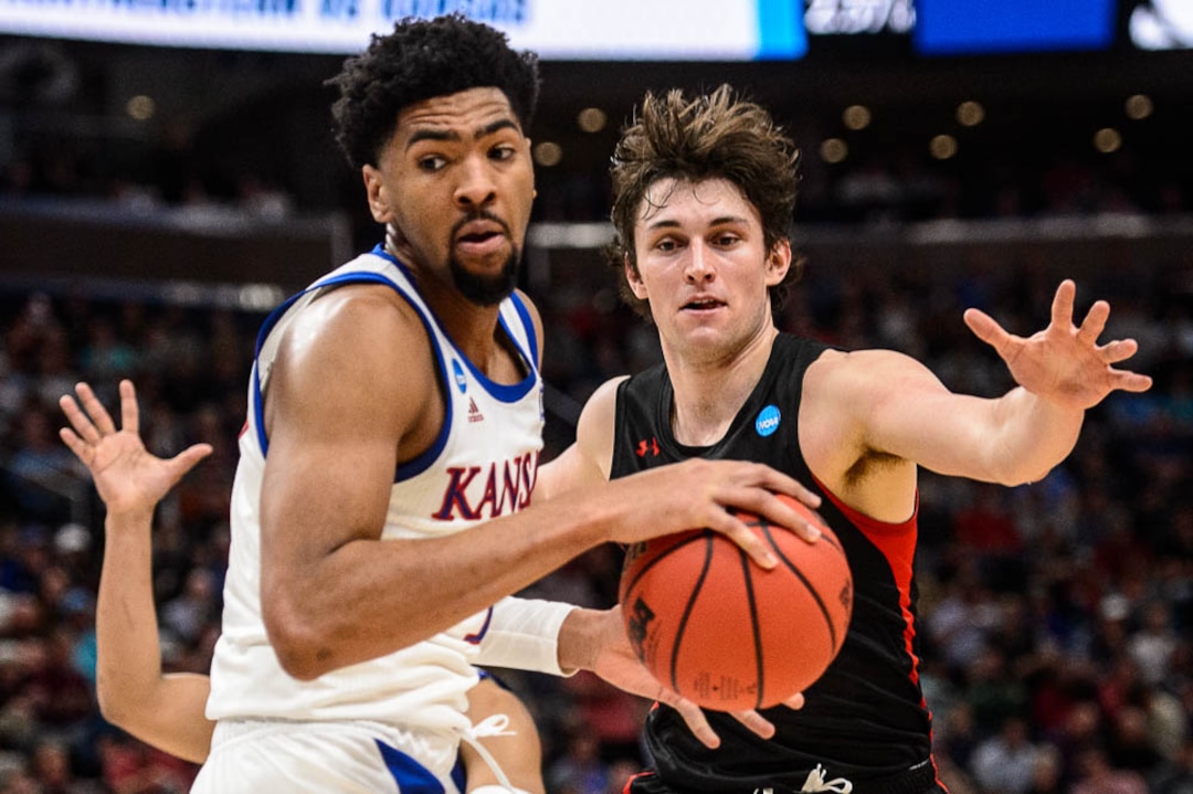 (Trent Nelson | The Salt Lake Tribune)  Kansas Jayhawks forward Dedric Lawson (1) and Northeastern Huskies guard Bolden Brace (20) as Kansas faces Northeastern in the 2019 NCAA Tournament in Salt Lake City on Thursday March 21, 2019.