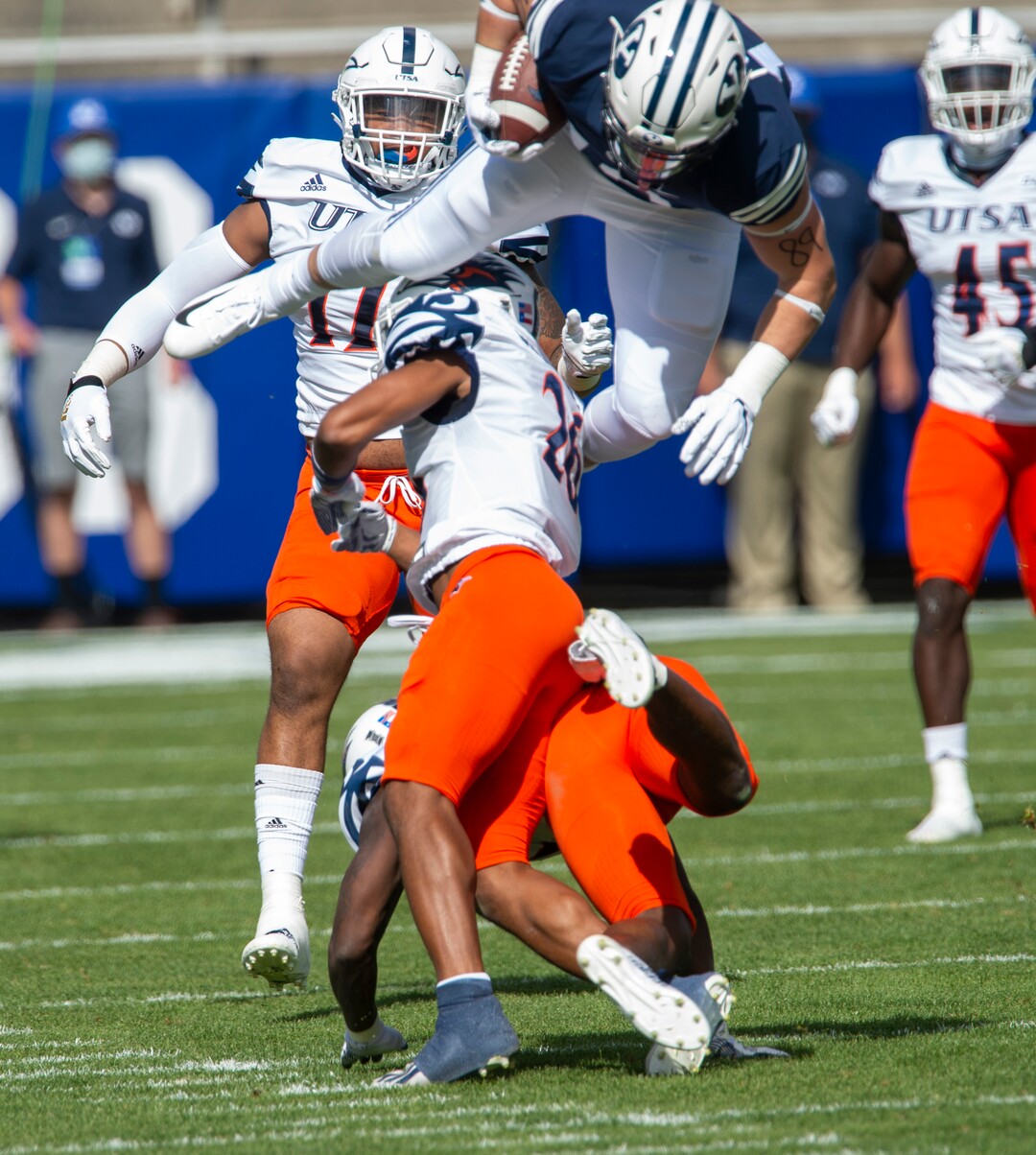 (Rick Egan  |  The Salt Lake Tribune)    Brigham Young Cougars tight end Masen Wake (13) leaps over the top of UTSA Roadrunners cornerback Corey Mayfield Jr. (26) in football action between the Brigham Young Cougars and the UTSA Roadrunners, at Lavell Edwards stadium, Saturday, Oct. 10, 2020.