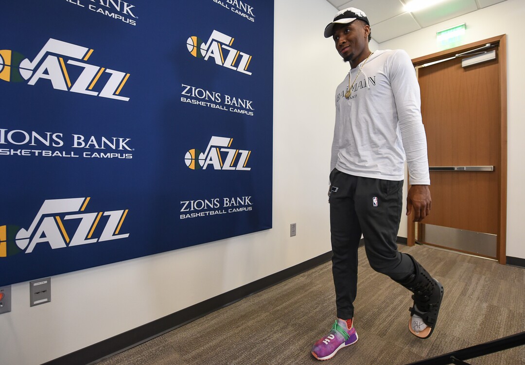 (Francisco Kjolseth  |  The Salt Lake Tribune)  Utah Jazz      guard Donovan Mitchell arrives to speak with the media during exit interviews wearing a boot at their practice facility in Salt Lake City Wed., May 8, 2018, after losing to the Houston Rockets in game 5 of their Western Conference Semifinals during the 2018 NBA Playoffs.