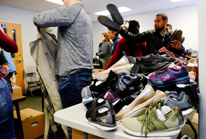 (Francisco Kjolseth | The Salt Lake Tribune) The Salt Lake City Mission at 1055 North Redwood Road in Salt Lake City, host a Thanksgiving banquet for the homeless and the hungry on Thursday, Nov. 28, 2019, as people line up to get shoes, jackets and hats.