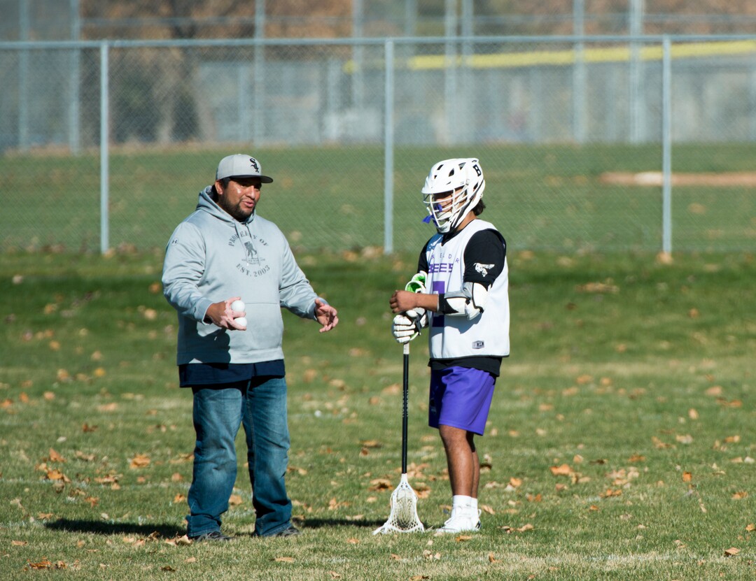 (Rick Egan | The Salt Lake Tribune) Brandyn Gaytan listens to his dad, Box Elder lacrosse coach Juan Gaytan, between games during a tournament in Logan on Saturday, Nov. 3, 2018.