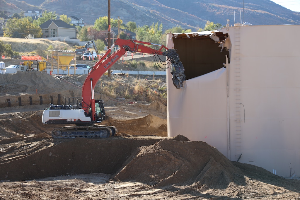 (Courtesy photo by Utah Department of Transportation) Crews demolish an iconic water tank in Layton on Oct. 12, 2020, part of a project to convert U.S. 89 into a freeway.