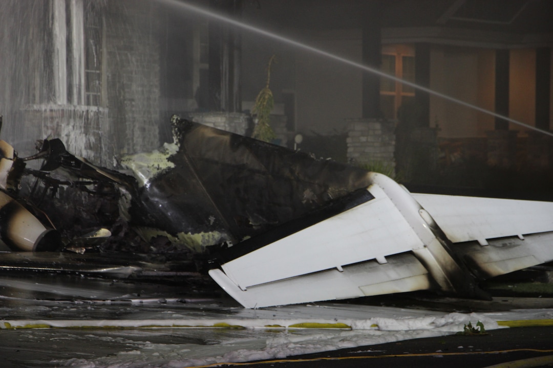 (Photo courtesy of FOX 13) A small plane crashed into a house in Payson early Monday, killing the pilot — but the two occupants of the home escaped without injury despite an explosion and fire that engulfed the structure.
