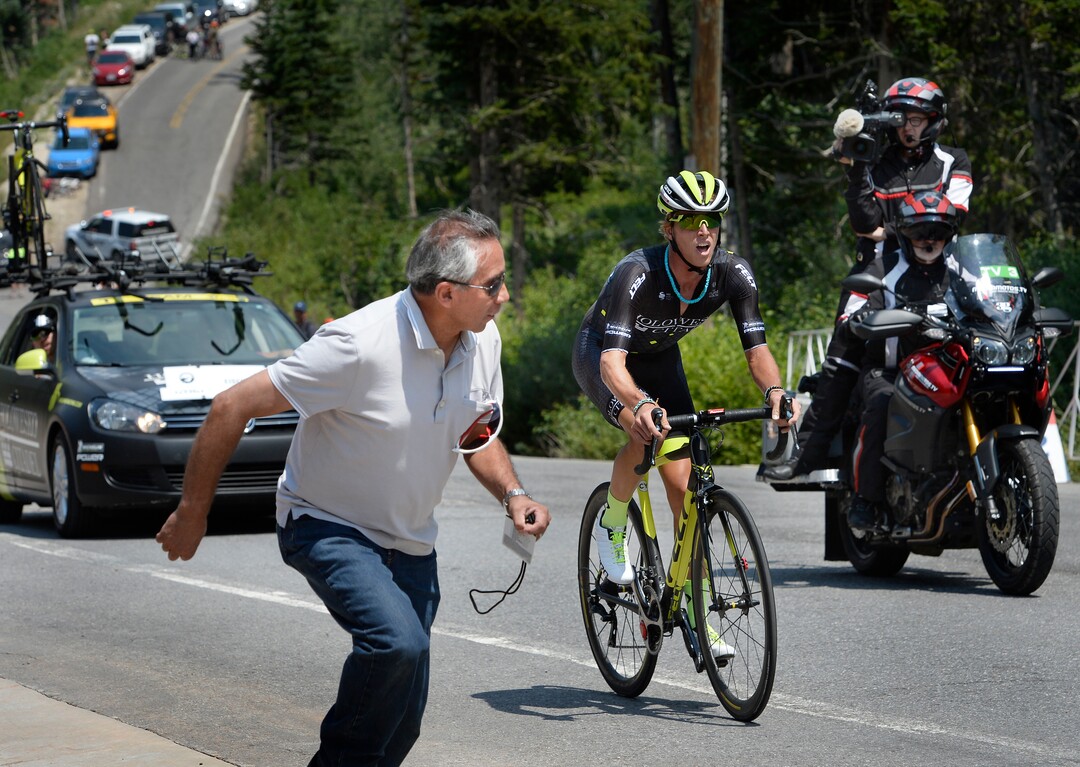 (Scott Sommerdorf   |  The Salt Lake Tribune)   Race fan Joe Torres runs alongside his favorite rider Taylor Eisenhart of Salt lake during stage 3 of the Tour of Utah in Big Cottonwood Canyon, Wednesday, August 2, 2017.