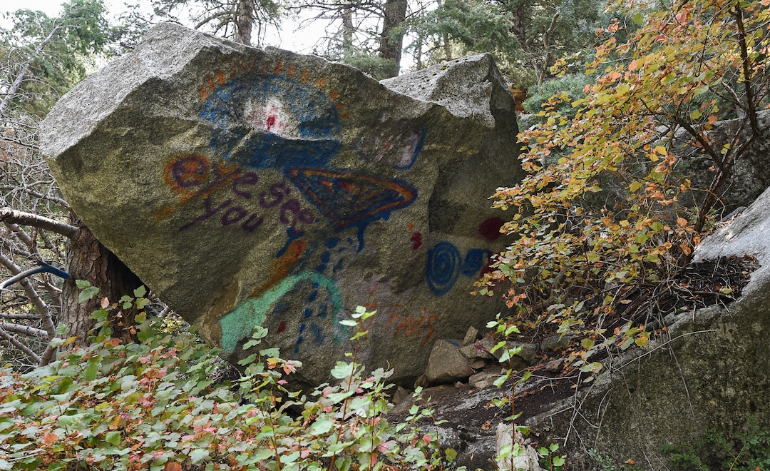 (Francisco Kjolseth  |  The Salt Lake Tribune)  Graffiti has proliferated in lower Little Cottonwood Canyon, where vandals, often wielding cans of fluorescent-colored spray paint, have covered granite faces, trees and structures. The vandalism is particularly apparent along the Temple Quarry Trail and the creek at the Moon Rock swimming hole and former pavilion site. Volunteers using donated equipment and solvents spend thousands of hours removing the paint from the rocks only to see graffiti return to the same faces or on rock nearby.