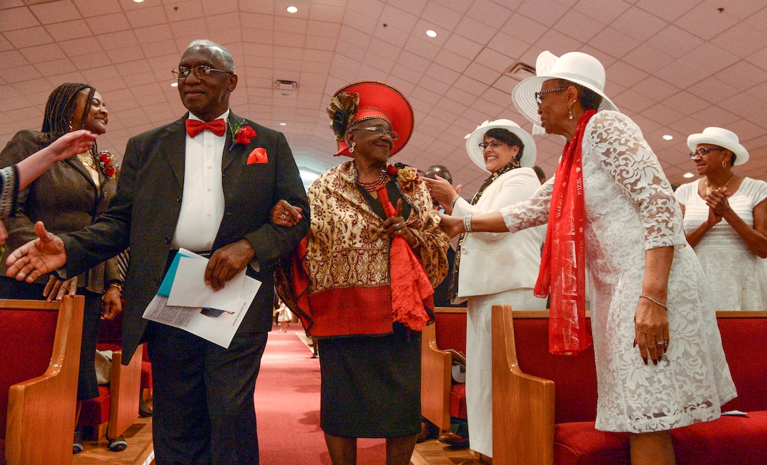 (Leah Hogsten  |  The Salt Lake Tribune) The Rev. France A. Davis and his wife Willene, celebrated Davis' 44th anniversary as pastor at Calvary Baptist Church. The two are greeted and congratulated by members of the congregation, Sunday, April 22, 2018, as they enter the nave. Davis, who arrived in Salt Lake City in 1974, has built the African-American congregation to more than 700 members. 