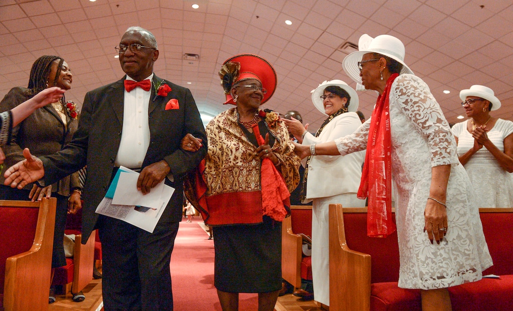 (Leah Hogsten | The Salt Lake Tribune) The Rev. France A. Davis and his wife Willene, celebrated Davis' 44th anniversary as pastor at Calvary Baptist Church. The two are greeted and congratulated by members of the congregation, Sunday, April 22, 2018, as they enter the nave. Davis, who arrived in Salt Lake City in 1974, has built the African-American congregation to more than 700 members.