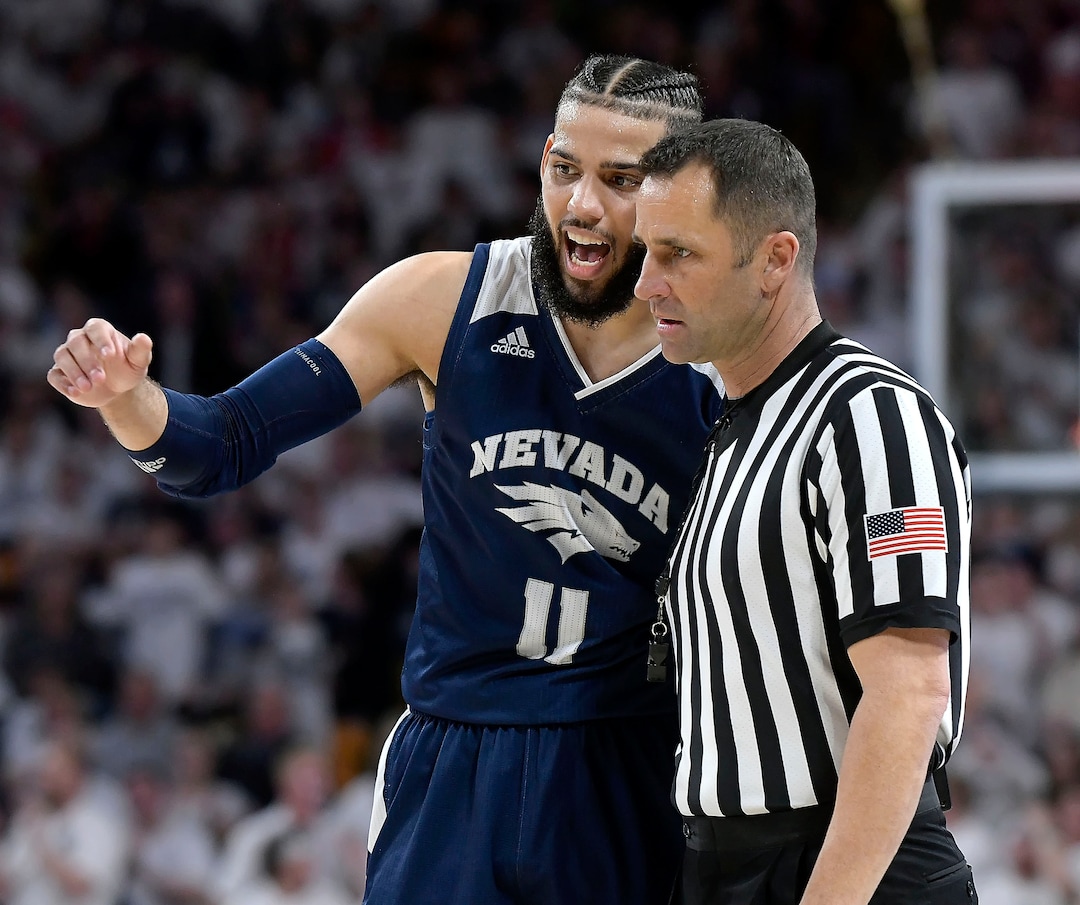 (Eli Lucero  |  The Herald Journal via AP) Nevada forward Cody Martin  talks to a referee after getting called for a foul against Utah State during an NCAA college basketball game Saturday, March 2, 2019, in Logan, Utah.