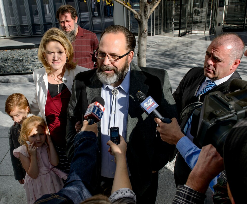 (Steve Griffin  |  The Salt Lake Tribune)   Former real estate guru Rick Koerber stands with his family outside the Federal Courthouse in Salt Lake City, as he talks with the media, after a federal jury announced they were deadlocked over the allegations against him. Koerber was accused of illegal business dealings and running a Ponzi scheme. U.S. District Court David Nuffer declared a mistrial in Salt Lake City Monday October 16, 2017.