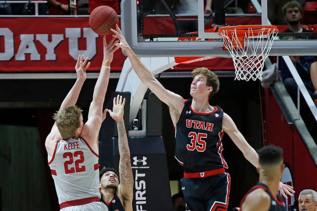Utah center Branden Carlson (35) blocks a shot by Stanford forward James Keefe (22) during the second half of an NCAA college basketball game Thursday, Feb. 6, 2020, in Salt Lake City. (AP Photo/Rick Bowmer)