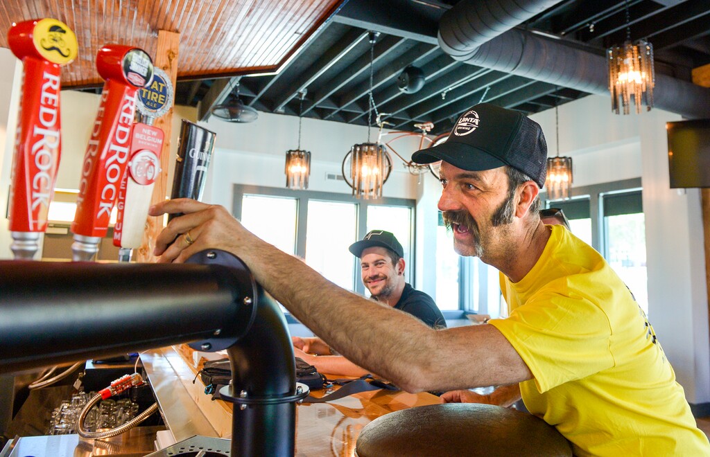 (Leah Hogsten | The Salt Lake Tribune) HandleBar co-owner David Morris draws a laugh from bar manager Ryan Stapley, left, as he tests the placement of a Guinness beer tap back in June. The bar now is boycotting Red Rock over comments made during a legislative hearing.