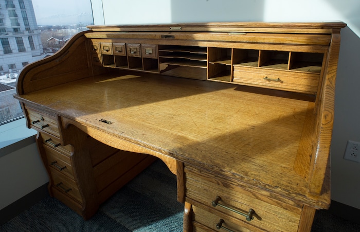 (Rick Egan  |  The Salt Lake Tribune)     Some of the furniture in Sim Gill's office is more than 100 years old. Friday, March 9, 2018.


