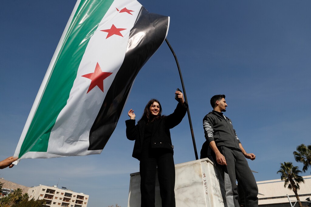 (Omar Sanadiki | AP) Syrians celebrate at Omayyad Square in Aleppo, Syria, Monday, Dec. 9, 2024.
