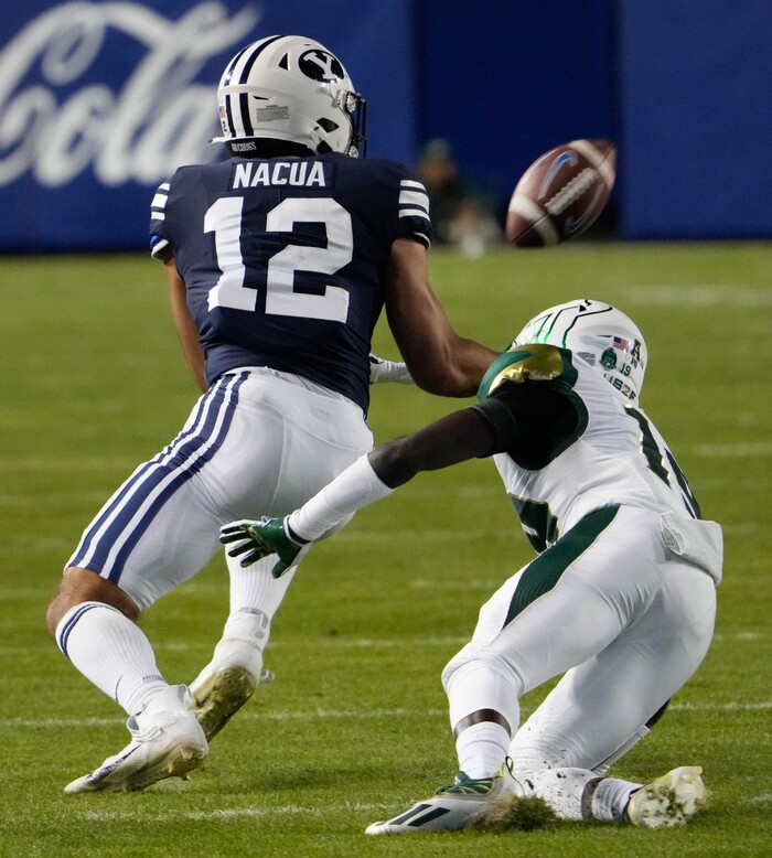 (Francisco Kjolseth | The Salt Lake Tribune) Brigham Young Cougars wide receiver Puka Nacua pulls in a pass over South Florida Bulls defensive back Jalen Herring (19) in game action between the Brigham Young Cougars and the South Florida Bulls at LaVell Edwards Stadium in Provo, Saturday, Sept. 25, 2021.