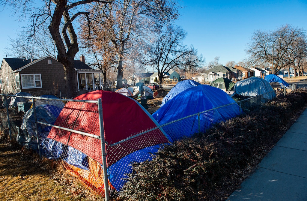 (Rick Egan | The Salt Lake Tribune) Tents line the front yard of Darin Mann's property, on Wednesday, Jan. 20, 2021.