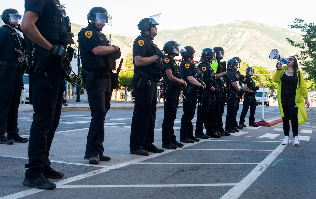 (Rick Egan | The Salt Lake Tribune) Salt Lake City Police officers warn protesters that they will be arrested if they don't stay on the sidewalk as then march for justice for Bernardo on Tuesday, June 23, 2020.