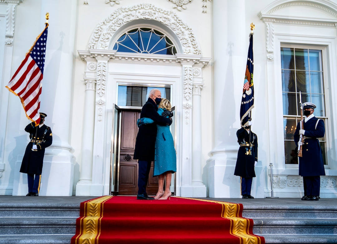 President Joe Biden and first lady Jill Biden embrace in front of the White House in Washington during the Presidential Escort, part of Inauguration Day ceremonies on Wednesday, Jan. 20, 2021. (Doug Mills/The New York Times)