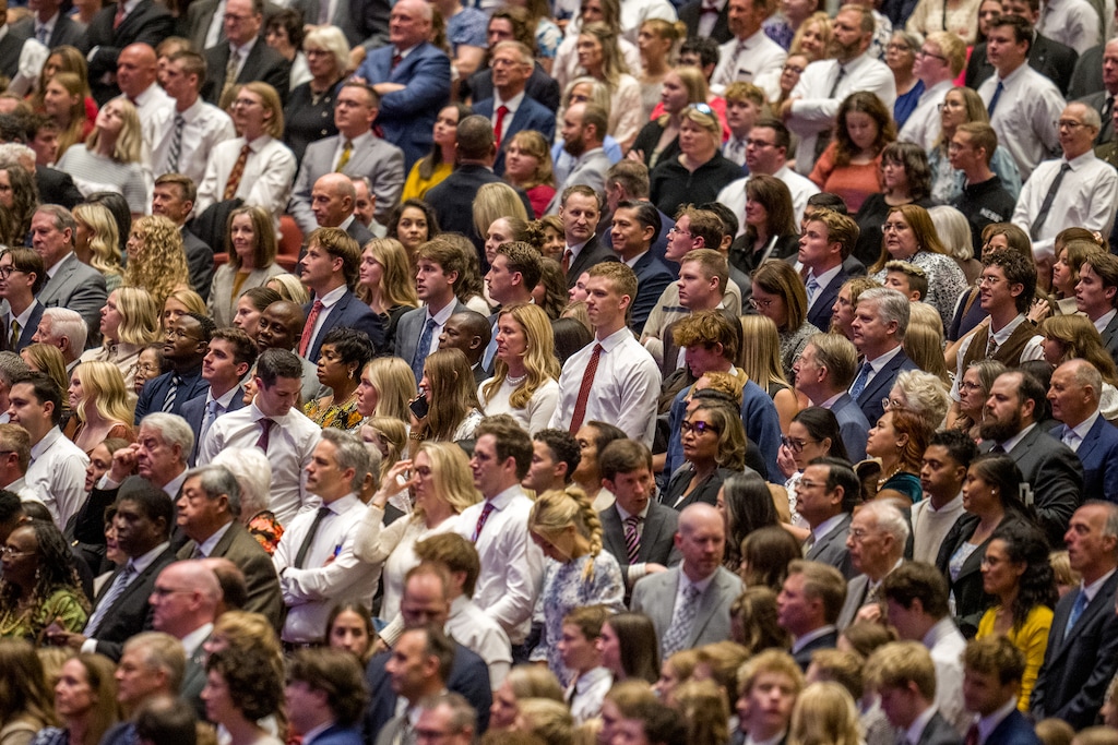 (Trent Nelson  |  The Salt Lake Tribune) Attendees stand at the start of a General Conference session in 2025. Latter-day Saint retention has emerged as an issue in the global faith in the wake of recent research.