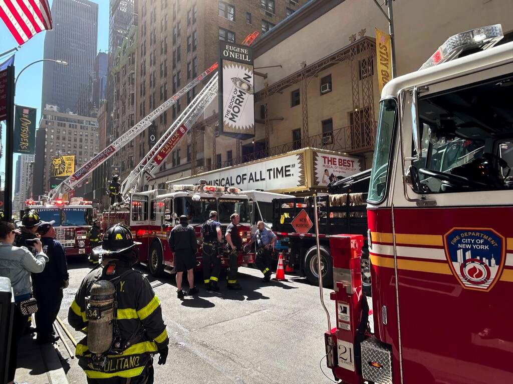 (Liam Stack | The New York Times) Firefighters outside of the Eugene O’Neill Theater, home to “The Book of Mormon,” in Manhattan, on Monday, May 4, 2026.