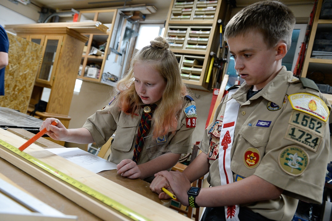 (Francisco Kjolseth  |  The Salt Lake Tribune)  Miriam Cook, 11, helps her brother Kolbie, 12, with his Eagle Scout project as they assemble bird houses in the family garage in Tooele on Monday, May 14, 2018. Miriam, who is one of the early adopters into the Cub Scouts, has always been interested in the things her brother did in Scouting. Her goal is to earn her Arrow of Light, the bridge from Cub Scouts to Boy Scouts (which will change its name to Scouts BSA next February).