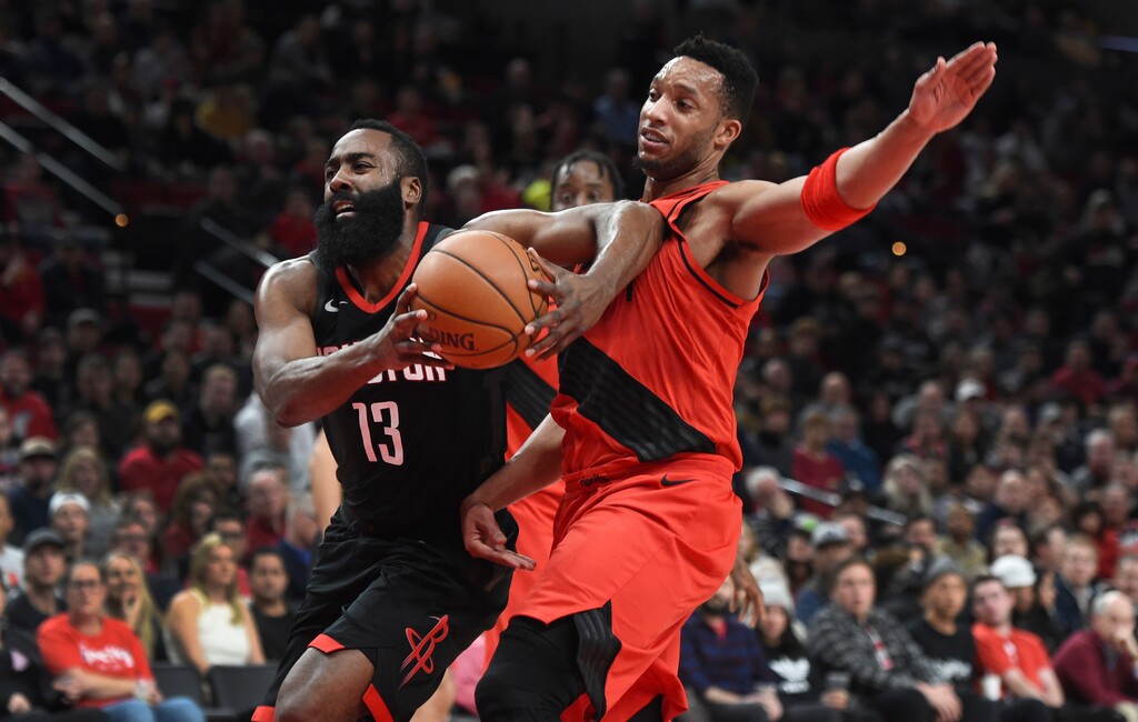Houston Rockets guard James Harden drives to the basket on Portland Trail Blazers guard Evan Turner during the first half of an NBA basketball game in Portland, Ore., Saturday, Dec. 9, 2017. (AP Photo/Steve Dykes)