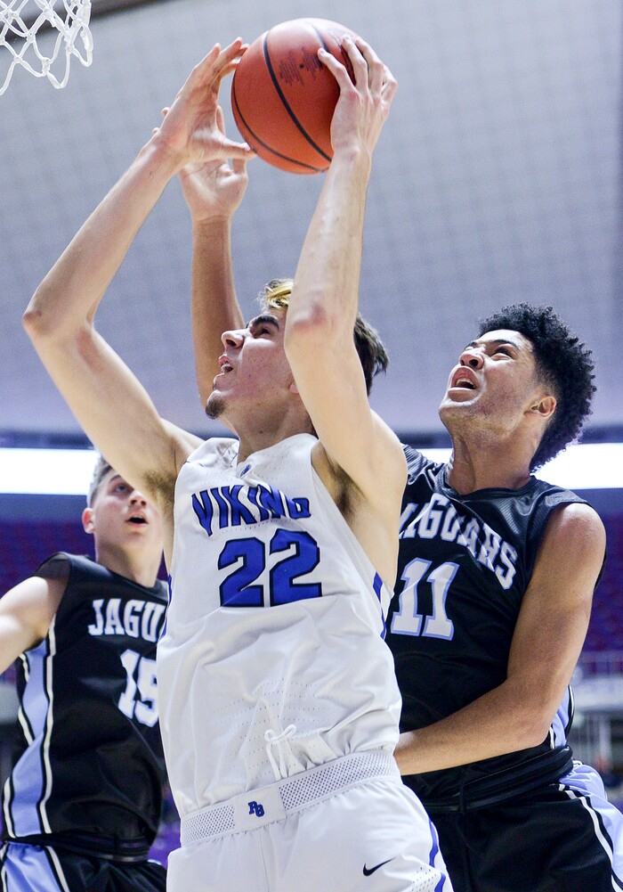 (Leah Hogsten  |  The Salt Lake Tribune) West Jordan's Darrian Nebeker (11) tries to stop Pleasant Grove's Matt Van Komen (22) who had 14 points and 10 rebounds. Pleasant Grove defeated West Jordan 62-54 in the 6A High School Boys' Basketball Tournament opening game at Weber State University’s Dee Events Center in Ogden,  Tuesday, Feb. 27, 2018. 