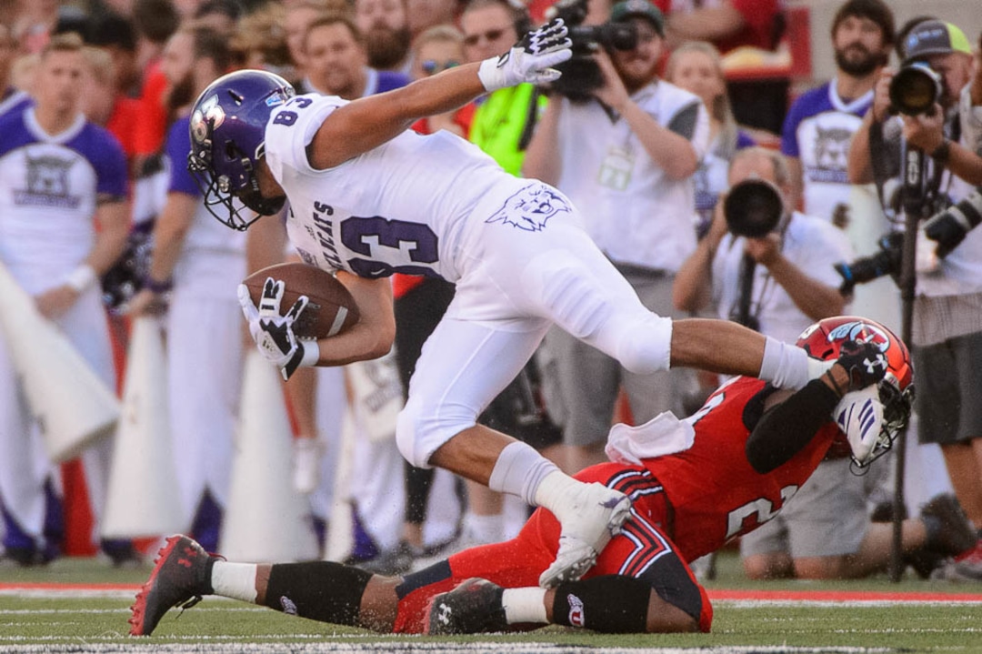 (Trent Nelson | The Salt Lake Tribune)  Weber State Wildcats wide receiver David Ames (83) and Utah Utes defensive back Julian Blackmon (23) as the University of Utah Utes host the Weber State Wildcats, Thursday Aug. 30, 2018 at Rice-Eccles Stadium in Salt Lake City.