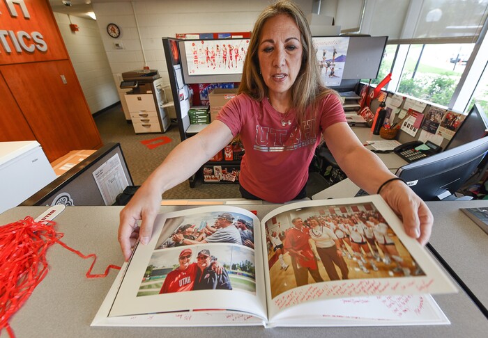 (Francisco Kjolseth  |  The Salt Lake Tribune)  Ex. Secretary Tanya Schmidt flips through a photo book being signed by staff for University of Utah athletics director Chris Hill before he says goodbye at the Huntsman Center on Friday, June 1, 2018, after 31 years on the job.