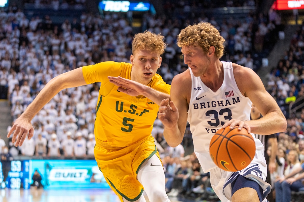 (Rick Egan | The Salt Lake Tribune)  Brigham Young Cougars forward Caleb Lohner takes the ball down the baseline, as San Francisco Dons forward Zane Meeks (5) defends, in West Coast Conference action at the Marriott Center in Provo, on Thursday, Feb. 3, 2022.