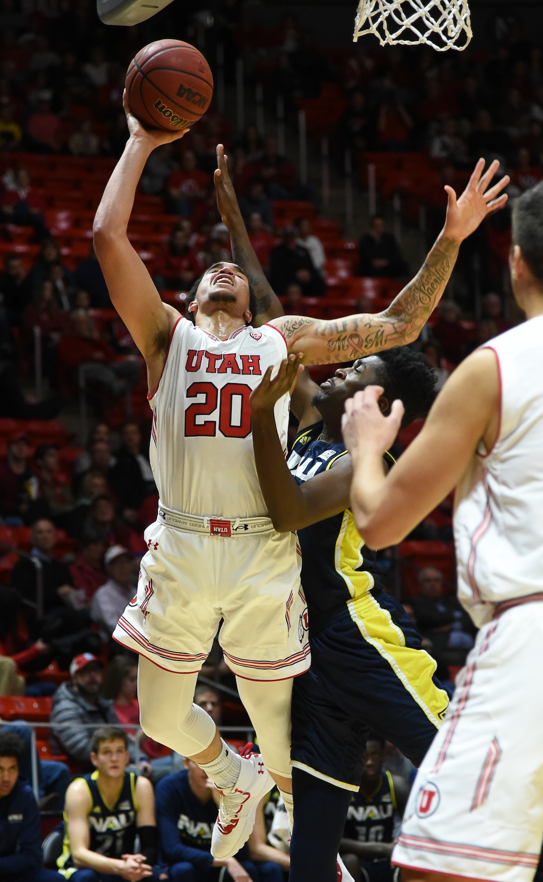 (Francisco Kjolseth  |  The Salt Lake Tribune)  Utah Utes forward Timmy Allen (20) tries to get past Northern Arizona  in Men's Basketball at the Jon M Huntsman Center in Salt Lake City, Utah, on Friday, Dec. 21, 2018.
