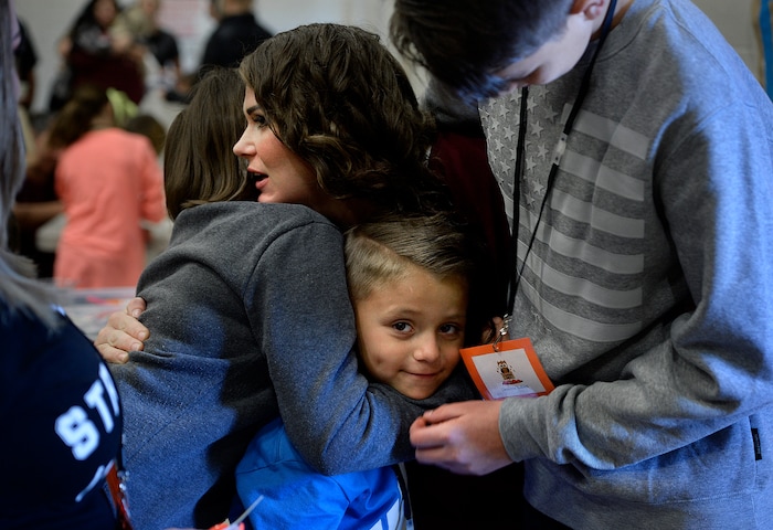 (Scott Sommerdorf   |  The Salt Lake Tribune)   Inmate Dianna Robles is surrounded in hugs as she says goodbye to her children Brooklyn, left, Cameron, center, and Demitrie, right, during "Kids Day" at the Utah State Prison, Saturday, October 7, 2017.